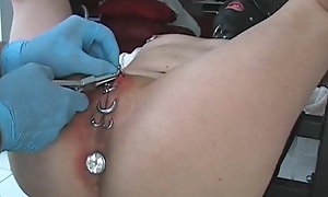 Slave's pussy getting pierced